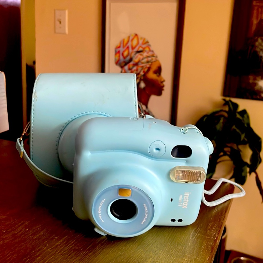 Baby blue Instax Polaroid camera